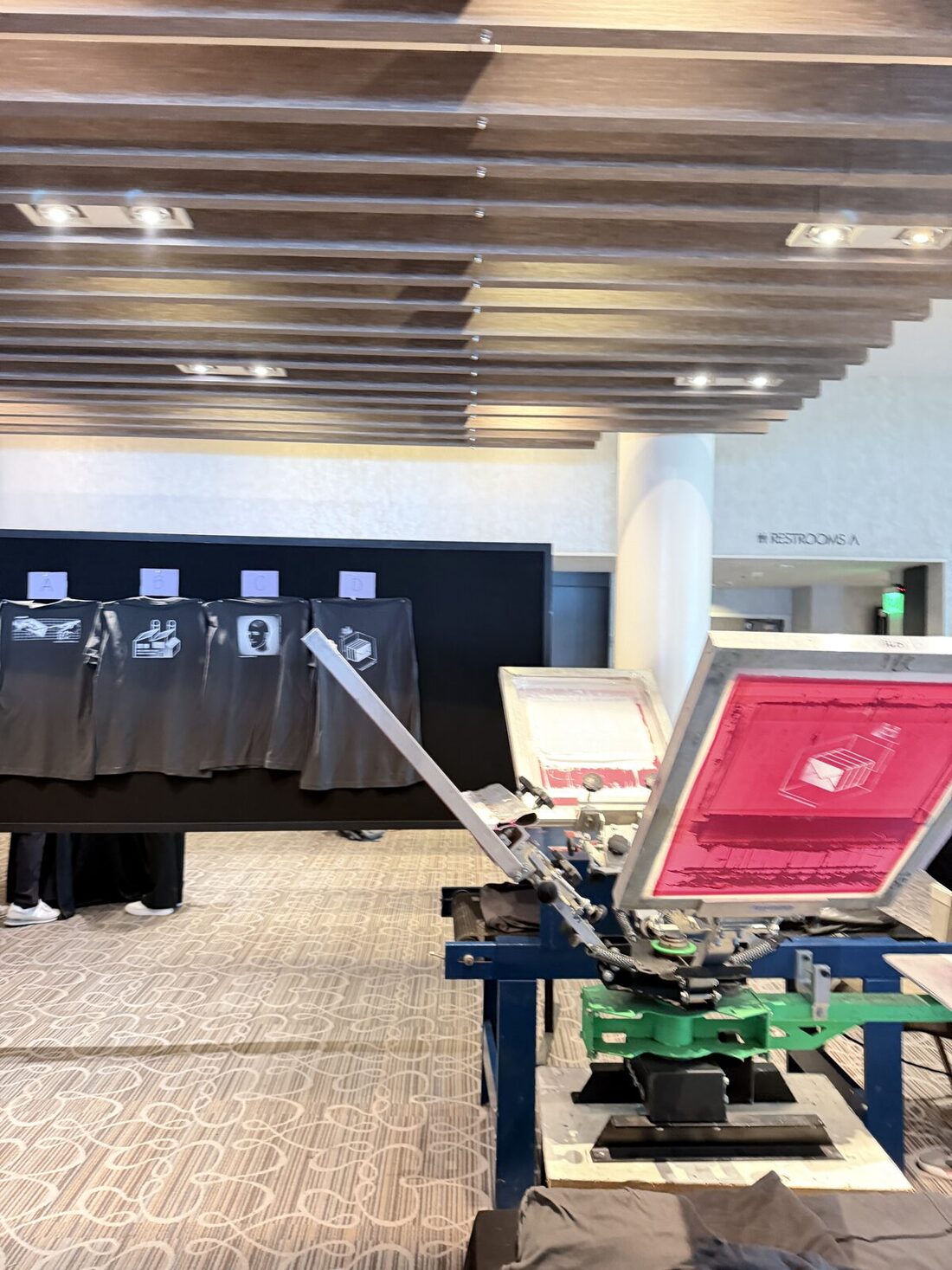 Merch Troop live screen-printing station running at a San Francisco event